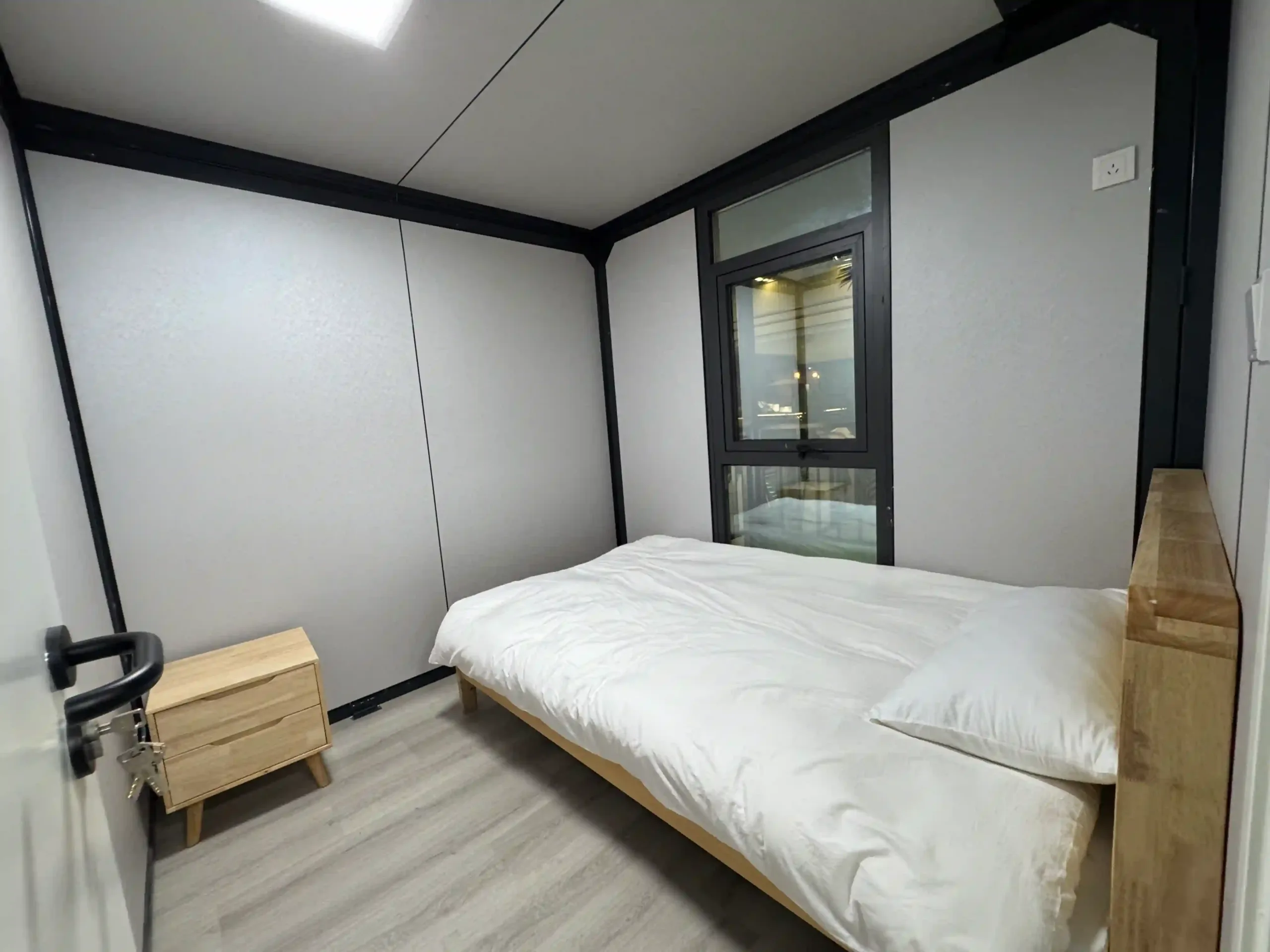 compact_expandable_container_house_interior_02 Living area of modular expandable container unit