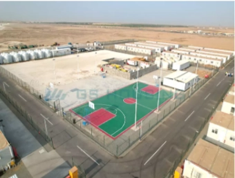 Expandable container worker camp deployed on active construction site