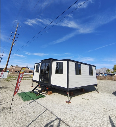 Expandable container house installed in urban edge community as flexible long-term housing